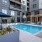 Unlimited Happy Hours graphic for Broadstone Craft apartments for rent in Charlotte, NC, featuring the resident lounge.