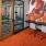 The offices and co working spaces at Broadstone Craft apartments for rent in Charlotte, NC, featuring desks with chairs.