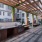 The outdoor lounge at Broadstone Craft apartments for rent in Charlotte, NC, featuring grill stations and umbrellas.